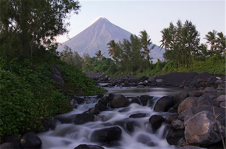 simsearch:841-02916952,k - Waterfall beneath Mount Mayon, 2462m, a volcanic cone with plume of smoke, Bicol Province, southeast Luzon, Philippines, Southeast Asia, Asia Stock Photo - Rights-Managed, Code: 841-03055204