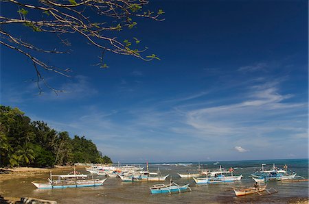 philippine fishing boat pictures - Colourful fishing boats on beach, Sabang Town, Palawan, Philippines, Southeast Asia, Asia Stock Photo - Rights-Managed, Code: 841-03055245