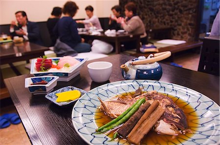 Traditional Japanese meal of sushi and fish head, Tokyo, Honshu Island, Japan, Asia Stock Photo - Rights-Managed, Code: 841-03055578