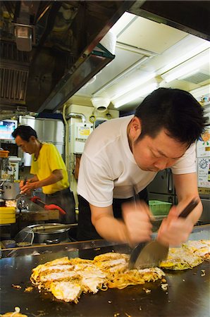 Okonomiyaki Japanese pancake being made at Fast Food Outlet at Okonomimura, Hiroshima City, Hiroshima prefecture, Honshu Island, Japan, Asia Stock Photo - Rights-Managed, Code: 841-03055628