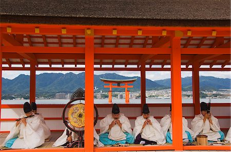 A Wedding Ceremony musical performance in front of the Floating Torii Gate at Itsukushima Shrine, founded in 593, UNESCO World Heritage Site, Miyajima Island, Hiroshima prefecture, Honshu Island, Japan, Asia Stock Photo - Rights-Managed, Code: 841-03055632