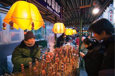 A street market selling local snacks and sweet hawthorne on sticks, Daoliqu area, Harbin, Heilongjiang Province, Northeast China, China, Asia Stock Photo - Rights-Managed, Code: 841-03055923