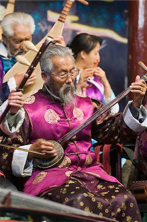 simsearch:855-03254989,k - Musicians in a traditional Naxi orchestra, Lijiang Old Town, UNESCO World Heritage Site, Yunnan Province, China, Asia Stock Photo - Rights-Managed, Code: 841-03056044