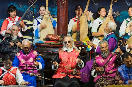 Musicians in a traditional Naxi orchestra, Lijiang Old Town, UNESCO World Heritage Site, Yunnan Province, China, Asia Stock Photo - Rights-Managed, Code: 841-03056045