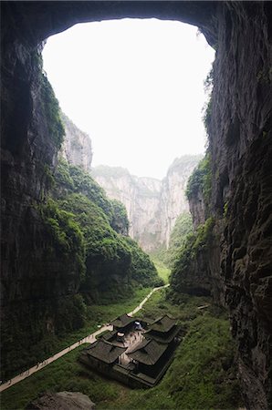 people in cave - Temple building at Wulong Natural Rock Bridges, UNESCO World Heritage Site, Chongqing Municipality, China, Asia Stock Photo - Rights-Managed, Code: 841-03056059