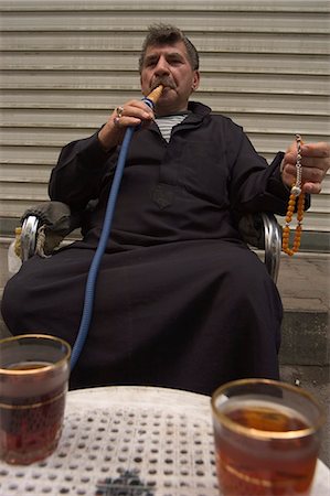 Man smoking water pipe, Aleppo (Haleb), Syria, Middle East Stock Photo - Rights-Managed, Code: 841-03056496