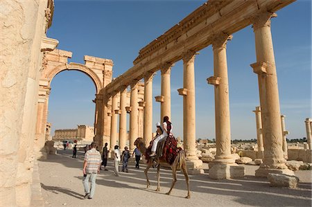 Tourist camel ride, monumental arch, archaelogical ruins, Palmyra, UNESCO World Heritage Site, Syria, Middle East Stock Photo - Rights-Managed, Code: 841-03056618