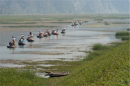 Punting boats on delta river, Van Long, Ninh Binh, south of Hanoi, North Vietnam, Southeast Asia, Asia Stock Photo - Rights-Managed, Code: 841-03056729