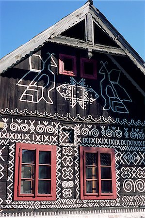 Unique decoration of houses based on patterns used in traditional embroidery in village of Cicmany, UNESCO World Heritage Site, Zilina region, Slovakia, Europe Stock Photo - Rights-Managed, Code: 841-03056897