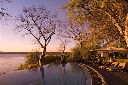 Le lodge Club River, coucher de soleil sur le fleuve Zambèze, Zambie, Afrique Photographie de stock - Rights-Managed, Code: 841-03058820