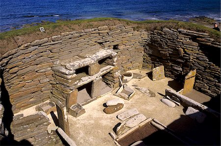 One of eight stone houses with stone furniture including beds, a central hearth and stone dresser, Skara Brae, neolithic village dating from between 3200 and 2200 BC, UNESCO World Heritage Site, Mainland, Orkney Islands, Scotland, United Kingdom, Europe Stock Photo - Rights-Managed, Code: 841-03064657