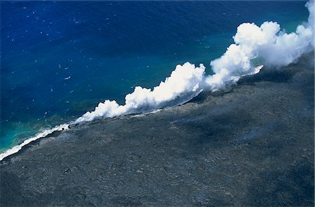 simsearch:841-03067371,k - Steam cloud rising where lava from the Pu'u O'o cinder cone far inland enters sea on southeast Puna coast near Kaimu, Big Island, Hawaii, Hawaiian Islands, United States of America, Pacific, North America Stock Photo - Rights-Managed, Code: 841-03067356
