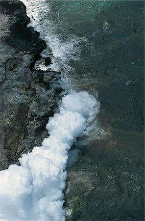 simsearch:841-03067371,k - Steam cloud rising where lava from the Pu'u O'o cinder cone far inland enters sea on southeast Puna coast near Kaimu, Big Island, Hawaii, Hawaiian Islands, United States of America, Pacific, North America Stock Photo - Rights-Managed, Code: 841-03067383