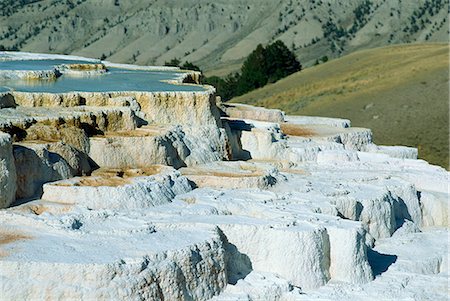 simsearch:841-03031311,k - Limestone terraces formed by volcanic water depositing six inches of calcium carbonate a year, Mammoth Hot Springs and Terraces, Yellowstone National Park, UNESCO World Heritage Site, Wyoming, United States of America, North America Foto de stock - Con derechos protegidos, Código: 841-03067445