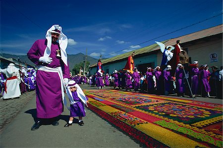 One of the famous Easter processions, with road carpeted with coloured sawdust, Antigua, Guatemala, Central America Stock Photo - Rights-Managed, Code: 841-03067567