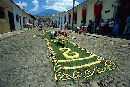 semana santa - Carpet of plants and flowers being laid on a street for one of the Easter processions, Antigua, Guatemala, Central America Stock Photo - Rights-Managed, Code: 841-03067562