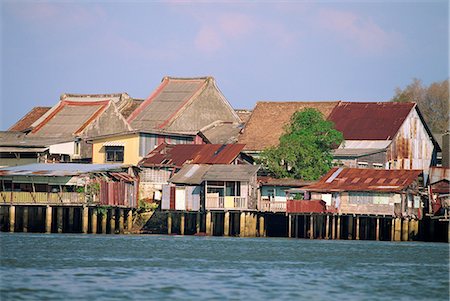 Traditional stilt houses by the Terengganu River in Kuala Terengganu, capital of Terengganu state, Malaysia, Southeast Asia, Asia Foto de stock - Con derechos protegidos, Código: 841-03067651