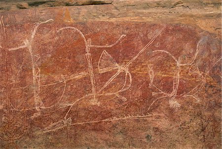 rock painting aboriginal - Warrior frieze at the Aboriginal rock art site at Ubirr Rock, Kakadu National Park, where paintings date from 20000 years old to present day, UNESCO World Heritage Site, Northern Territory, Australia, Pacific Stock Photo - Rights-Managed, Code: 841-03067689