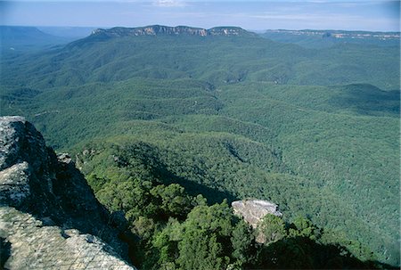 Eucalyptus oil haze causes the blueness above the dense gum tree forest in the Jamison Valley in the Blue Mountains National Park, UNESCO World Heritage Site, south of Katoomba, New South Wales (N.S.W.), Australia, Pacific Stock Photo - Rights-Managed, Code: 841-03067721