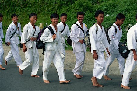 Local young men on their way to outdoor karate practice, Berastagi, Karo Highlands, Sumatra, Indonesia, Southeast Asia Foto de stock - Con derechos protegidos, Código: 841-03067770