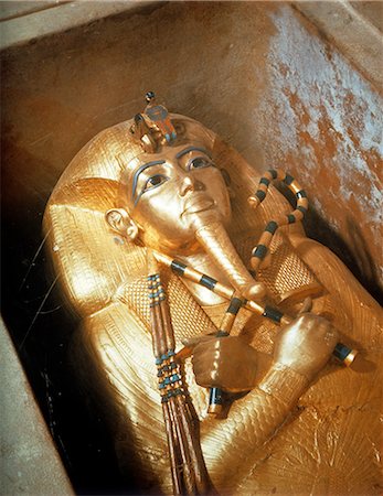 Detail of the second mummiform coffin made from gold-plated wood inlaid with glass-paste, from the tomb of the pharaoh Tutankhamun, discovered in the Valley of the Kings, Thebes, Egypt, North Africa, Africa Stock Photo - Rights-Managed, Code: 841-03060957
