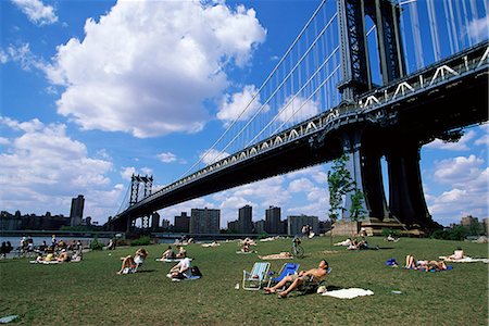 People sunbathing at a park in Brooklyn under the Manhattan Bridge, New York, New York State, United States of America, North America Stock Photo - Rights-Managed, Code: 841-03061830