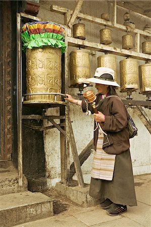 Woman circuits the inner Jokhang temple, walking the circumambulation pathway (Nangkhor), Jokhang temple, Barkhor, Lhasa, Tibet, China, Asia Stock Photo - Rights-Managed, Code: 841-03062310