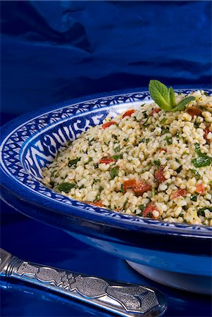 Arabic food, tabuleh, burghul with mint, tomatoes, lemon, parsley, olive oil, Middle East Stock Photo - Rights-Managed, Code: 841-03063396