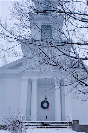 A traditional style wooden church with a Christmas wreath on the front door surrounded by snow, Rensselaerville, New York State, United States of America, North America Stock Photo - Rights-Managed, Code: 841-03454229