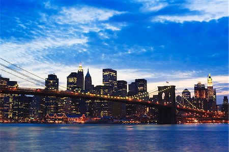 Brooklyn Bridge spanning the East River and the Lower Manhattan skyline at dusk, New York City, New York, United States of America, North America Stock Photo - Rights-Managed, Code: 841-03454351