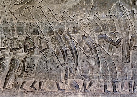 Early 12th century reliefs with later additions, in the gallery showing the Thais marching as allies of the Khmer army, Angkor Wat, Angkor, UNESCO World Heritage Site, Cambodia, Indochina, Southeast Asia, Asia Foto de stock - Direito Controlado, Número: 841-03489501