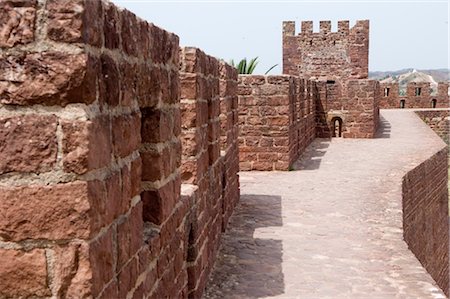 The largest castle in the Algarve and the most beautiful military monument of the Islamic period, the ramparts, were built during Moorish occupation probably on the site of a late Roman or Visigothic fort, Silves, Algarve, Portugal, Europe Stock Photo - Rights-Managed, Code: 841-03489976