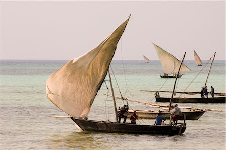 Fishing dhows setting sail in the afternoon from Nungwi, Zanzibar, Tanzania, East Africa, Africa Stock Photo - Rights-Managed, Code: 841-03483712