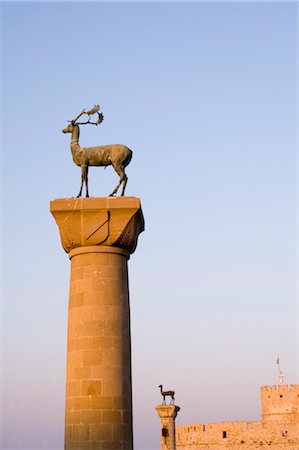 Stag and doe statues atop pillars at the entrance to Mandraki Harbour, Rhodes, Dodecanese Islands, Greek Islands, Greece, Europe Stock Photo - Rights-Managed, Code: 841-03505049