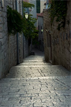 Worn stone steps between high walls in Rab Town, island of Rab, Kvarner region, Croatia, Europe Stock Photo - Rights-Managed, Code: 841-03505071