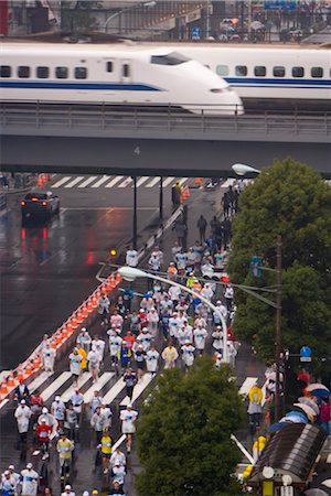 Elevated view of runners competing in the 2007 Tokyo marathon, Shinkansen (Bullet train) passing overhead, Sukiyabashi crossing, Ginza, Tokyo, Honshu, Japan, Asia Stock Photo - Rights-Managed, Code: 841-03505149