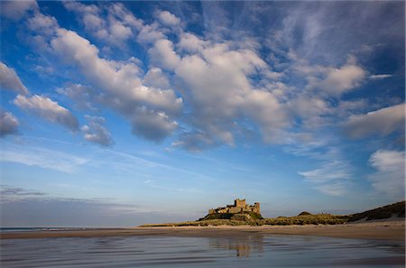 Bamburgh Castle bathed in evening light, viewed from Bamburgh Beach, Bamburgh, Northumberland, England, United Kingdom, Europe Stock Photo - Rights-Managed, Code: 841-03505240