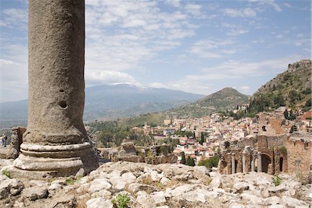 ruins sicily - Mount Etna viewed from the Greek and Roman theatre, Taormina, Sicily, Italy, Europe Stock Photo - Rights-Managed, Code: 841-03505658