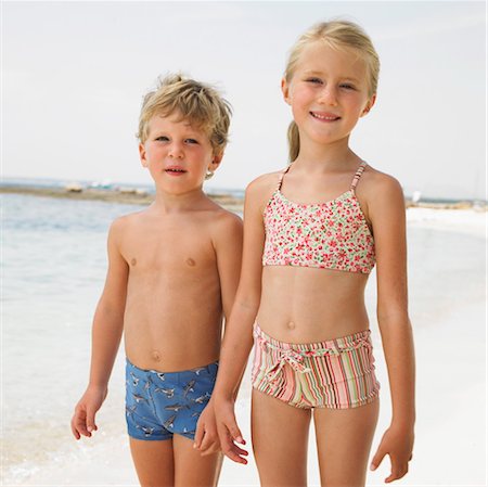 portrait of a boy and his sister standing on the beach - Boy and girl (6-8) on beach Stock Photo - Rights-Managed, Code: 841-03507730