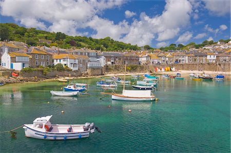 Small fishing boats in the enclosed harbour at Mousehole, Cornwall, England, United Kingdom, Europe Stock Photo - Rights-Managed, Code: 841-03517200
