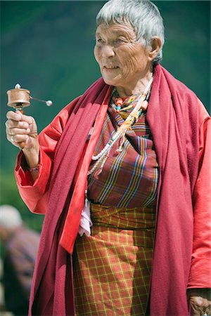 simsearch:841-07202444,k - Pilgrim spinning a prayer wheel at the National Memorial Chorten, Thimphu, Bhutan, Asia Stock Photo - Rights-Managed, Code: 841-03517352