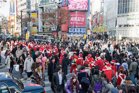 Christmas Santas walking across Shibuya crossing, Shibuya ward, Tokyo, Japan, Asia Stock Photo - Rights-Managed, Code: 841-03517371