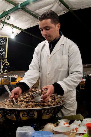 Cook serving snails from his stall in Djemaa el Fna, Place Jemaa el Fna (Djemaa el Fna), Marrakech (Marrakesh), Morocco, North Africa, Africa Stock Photo - Rights-Managed, Code: 841-03517873