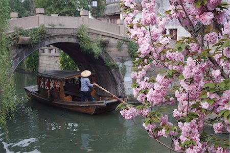 Boat passing under bridge along canal, Suzhou, Jiangsu, China, Asia Stock Photo - Rights-Managed, Code: 841-03518762