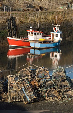 fishing boats scotland - Lobster creels in the foreground with fishing boats in the harbour, Crail, Fife, Scotland, United Kingdom, europe Stock Photo - Rights-Managed, Code: 841-03520010