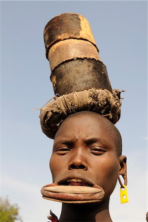 Traditional Mursi woman with lip plates, Omo Valley, Southern Ethiopia, Ethiopia, Africa Stock Photo - Rights-Managed, Code: 841-03520135