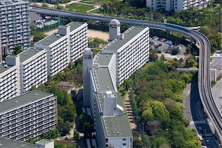 Monorail train weaving through housing development on Sakishima Island, Osaka, Japan Foto de stock - Con derechos protegidos, Código: 841-03520252