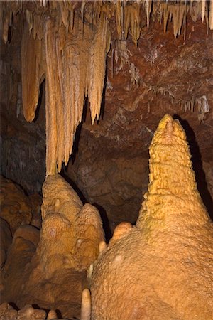 stalagmite - A variety of speleothems including stalactites, stalagmites, columns, straws and drapery at Ngilgi Cave, a limestone Karst cave system near Yallingup in the South West, Augusta-Margaret River Shire, Western Australia, Australia, Pacific Stock Photo - Rights-Managed, Code: 841-03520277