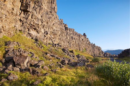 pingvellir national park - The Almannagja (All Man's Gorge) cliff face is the backdrop of the Althing, legislative assembly of the past, also the edge of the north American tectonic plate, Thingvellir National Park, UNESCO World Heritage Site, south-west Iceland (Sudurland), Iceland, Polar Regions Stock Photo - Rights-Managed, Code: 841-03674780