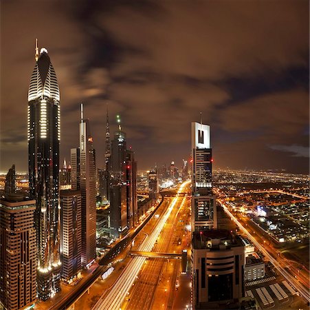 Elevated view over the modern Skyscrapers along Sheikh Zayed Road looking towards the Burj Kalifa, Dubai, United Arab Emirates, Middle East Stock Photo - Rights-Managed, Code: 841-03674931